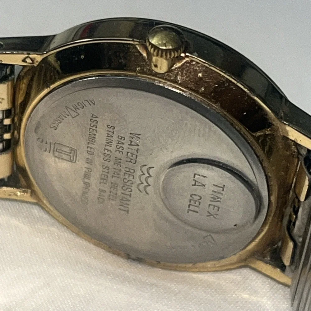 Vintage Gold Band Timex Watch. LA CELL. White Face. Metal Band. Needs Battery‎